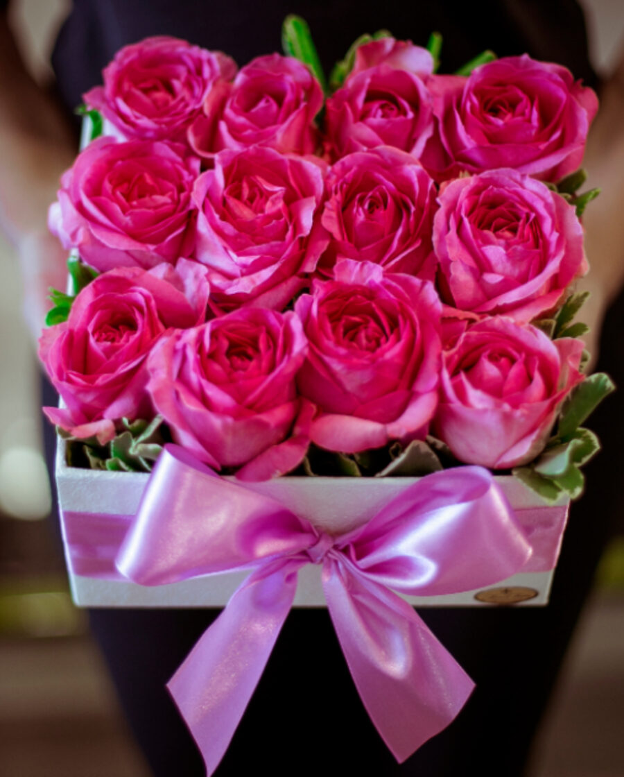 Lush pink roses arranged in a gift box by Flowers Always
